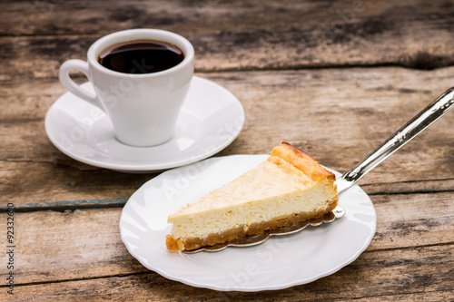 cup of coffee with slice of cheesecake