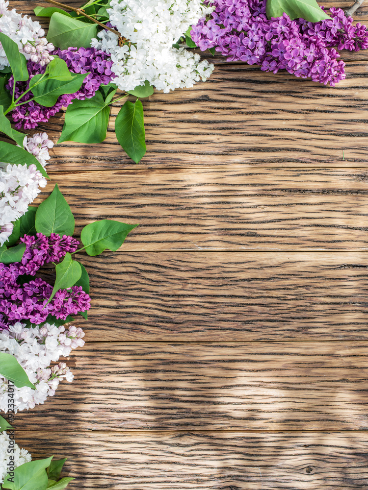 Blooming lilac flowers on the old wooden table. Blooming lilac flowers on the old wooden table.