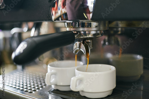 Coffee pouring into cups