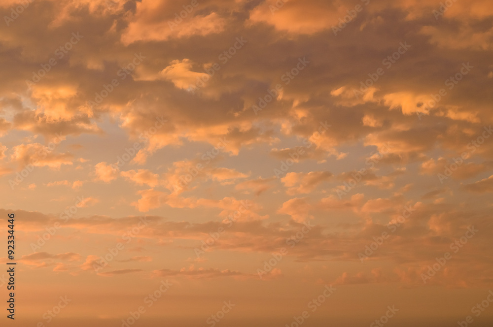 Fiery orange cloudscape, sundown background