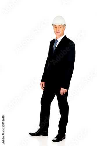 Smiling businessman with hard hat © Piotr Marcinski