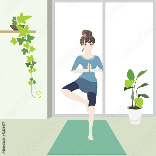 Cute girl in a yoga Tree pose