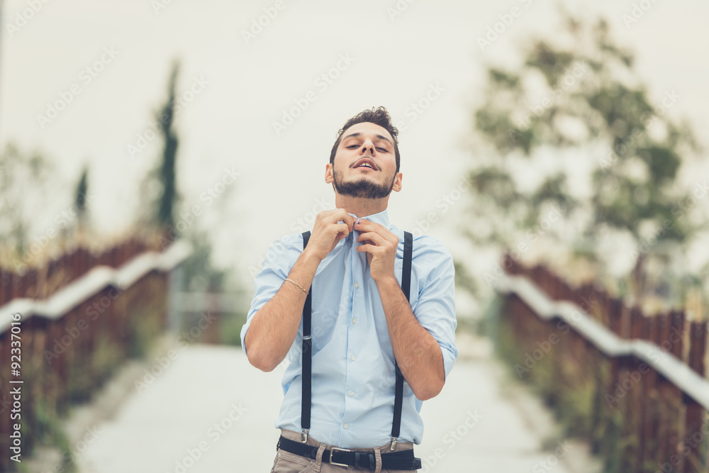 Young handsome man posing in an urban context Young handsome man posing in an urban context
