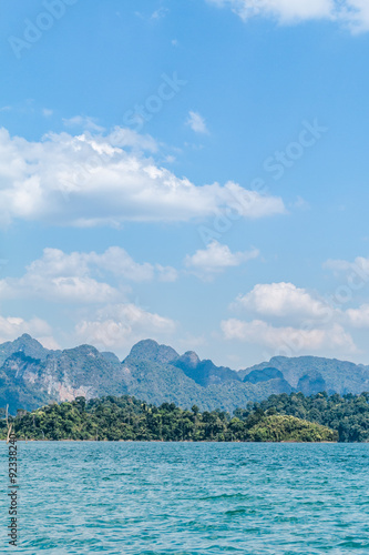 Blue clear water and blue sky with rock mountains reservoir lake