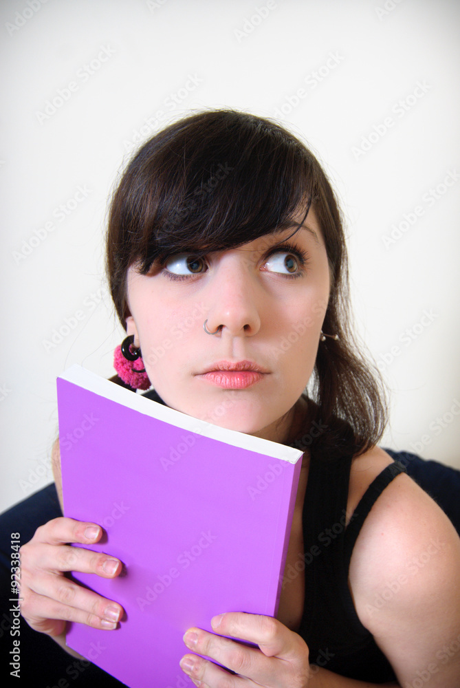 Young pretty brunette woman with book in hands Young pretty brunette woman with book in hands