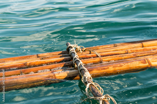 Vászonkép Broken bamboo raft float on the water