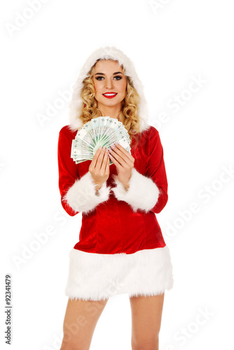 Beautiful santa woman holding a clip of polish money