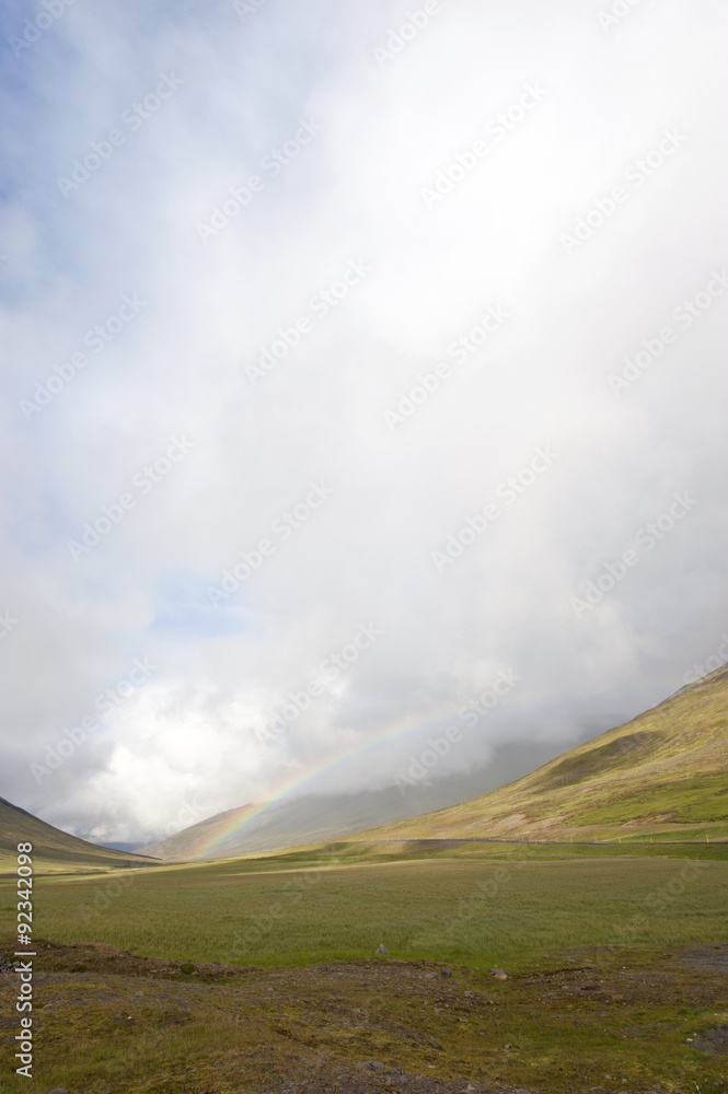 Rainbow over tundra landscape