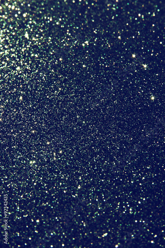 glitter vintage lights background. light silver, blue and black. defocused.
