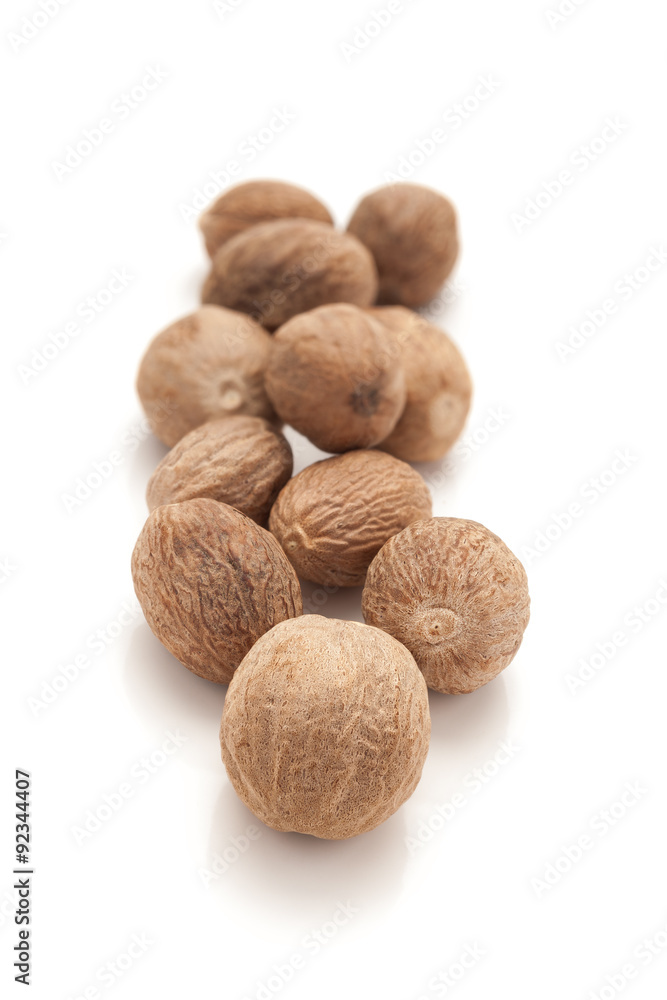 Row of Organic Nutmeg Seed or Jaiphal (Myristica fragrans) isolated on white background. Row of Organic Nutmeg Seed or Jaiphal (Myristica fragrans) isolated on white background.