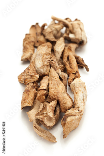 Row of Organic Sour dried mango or Aamchur or Amchoor (Mangifera indica) isolated on white background. photo