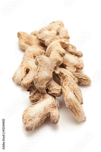 Row of Organic Dried Ginger root or Sonth (Zingiber officinale) isolated on white background.