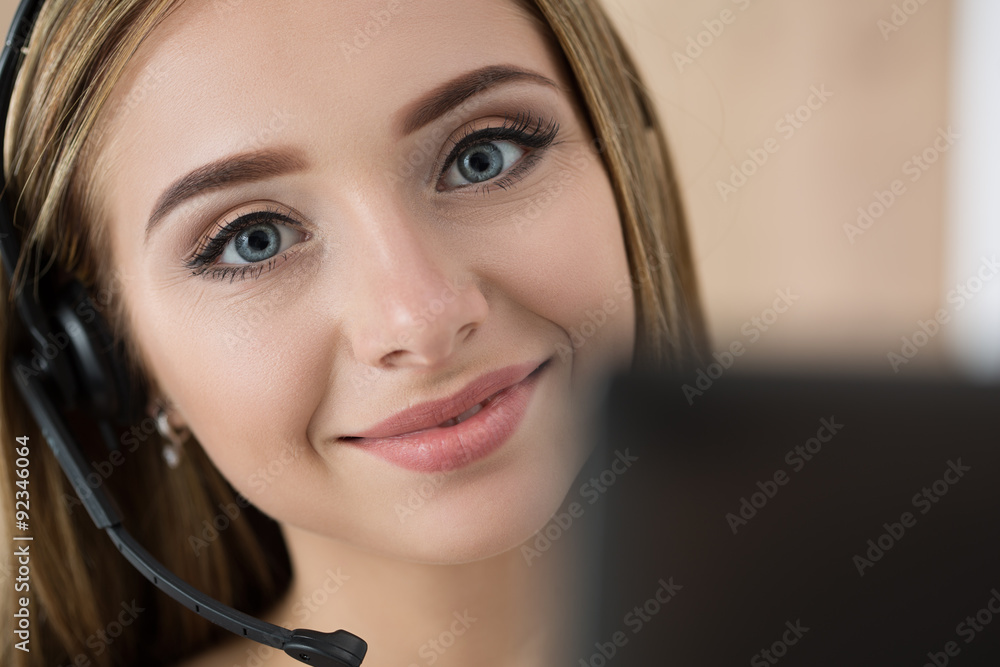 Portrait of beautiful call center operator at work