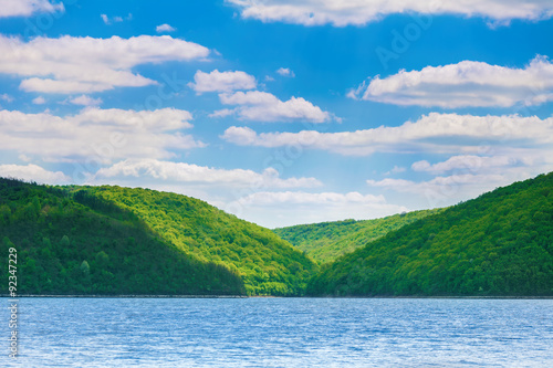 green hills on bank of river