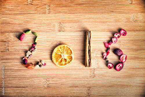 2016 written with spices on wooden background photo