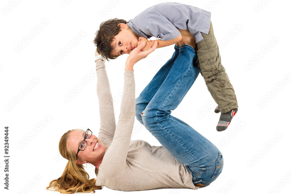 Mother and son are exercising together. Mother and son are exercising together.