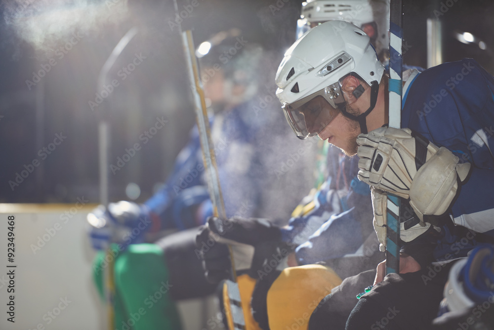 Fototapeta premium ice hockey players on bench