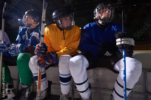 ice hockey players on bench