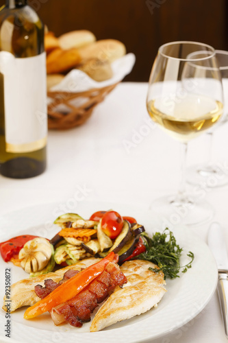 Meal in restaurant/Chicken breast roasted with bacon and vegetable.Ready to eat. Elegant served