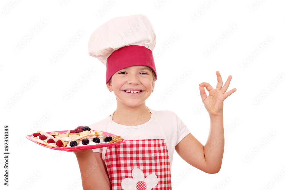 happy litle girl with crepes on plate and ok hand sign happy litle girl with crepes on plate and ok hand sign