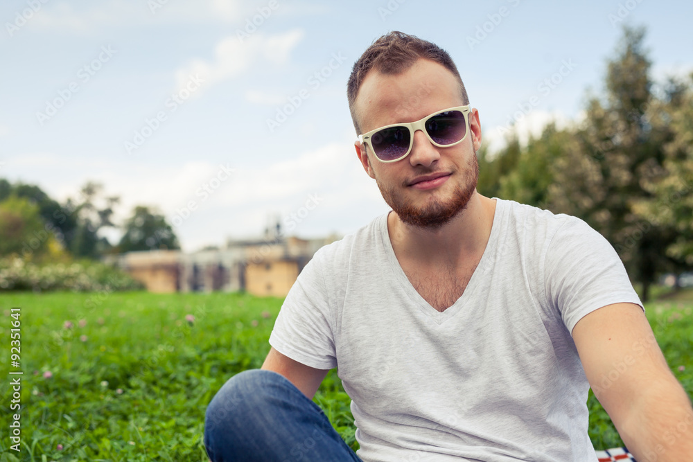 Portrait of bearded young man. Caucasian man smiling happy on sunny summer day. Portrait of bearded young man. Caucasian man smiling happy on sunny summer day.