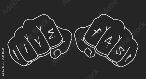 Fists with live fast fingers tattoo. Chalk