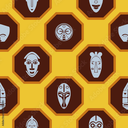 Seamless background with African ritual masks for your design
