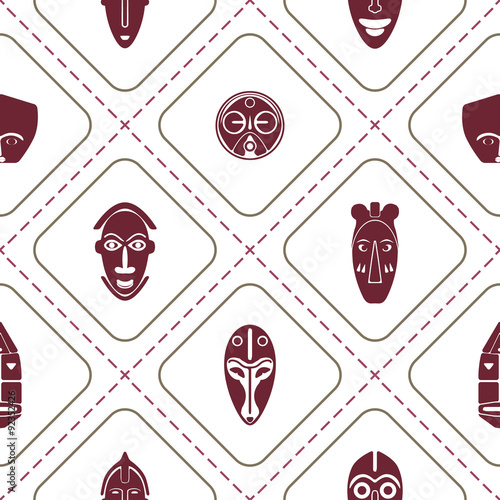 Seamless background with African ritual masks for your design