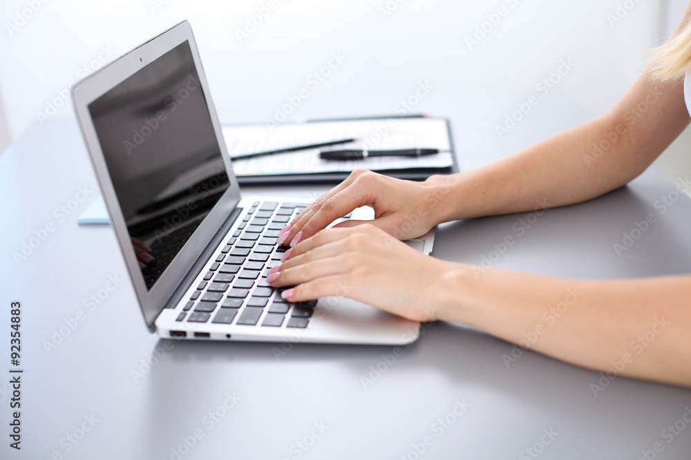 Close up of business woman hands typing on laptop computer Close up of business woman hands typing on laptop computer