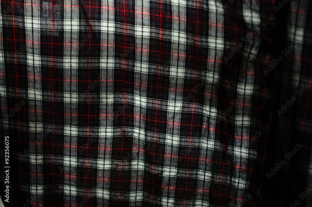 Close up of fabric plaid texture. Geometric background. Dark cru Close up of fabric plaid texture. Geometric background. Dark cru