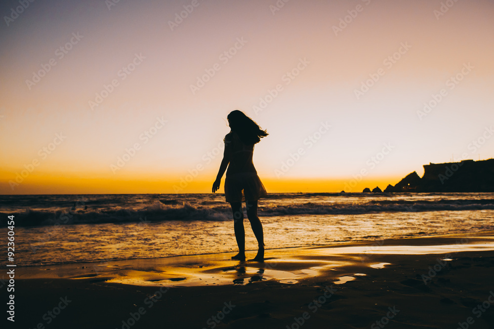 Sea beach girl silhouette, sunset