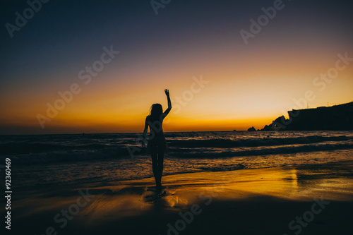 Sea beach girl silhouette  sunset