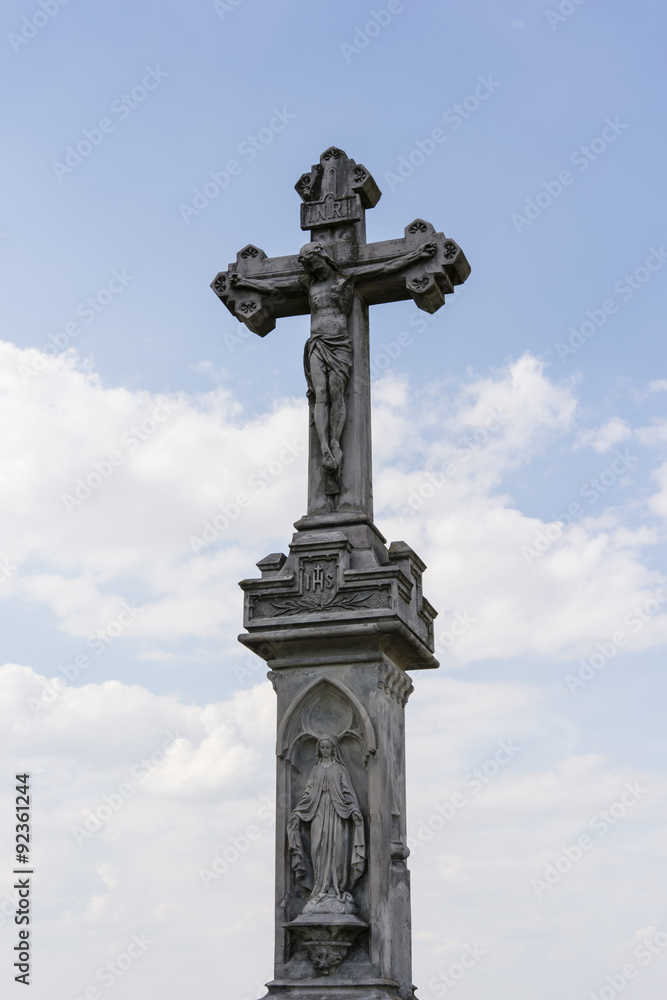 stone cross with Jesus