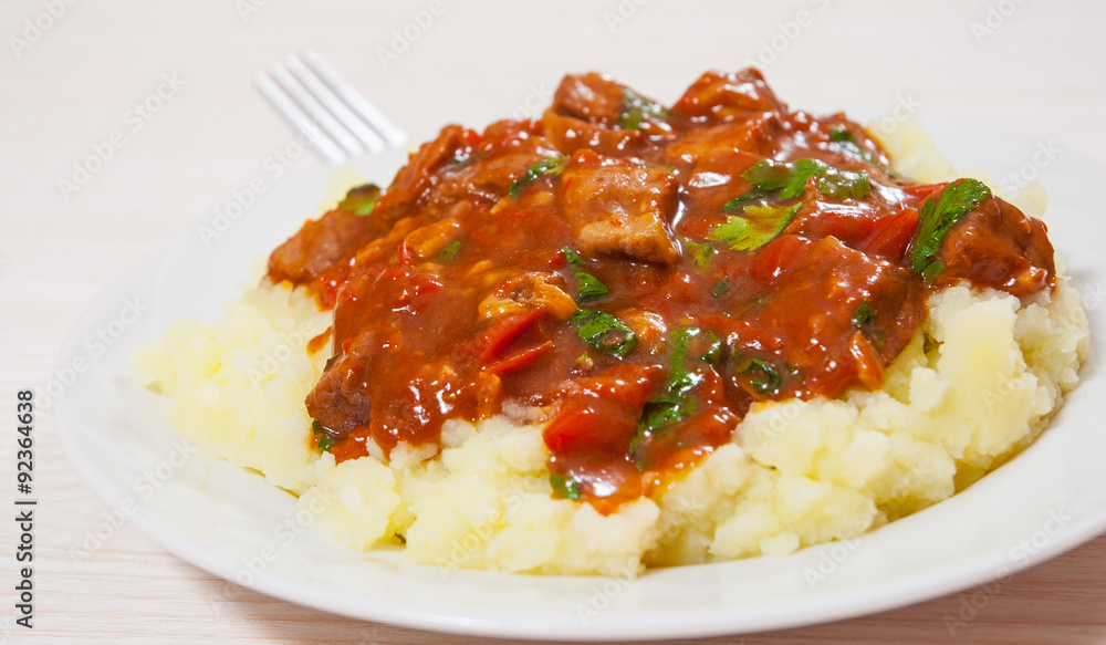 meat in sauce with mashed potatoes meat in sauce with mashed potatoes