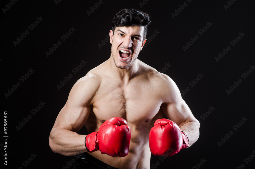 Muscular man in boxing concept Muscular man in boxing concept