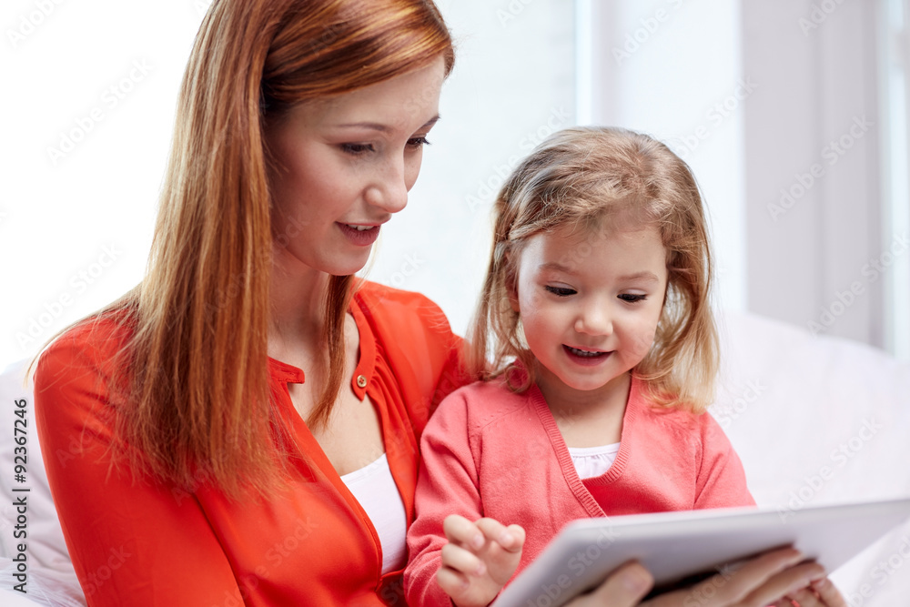 happy mother and daughter with tablet pc computer happy mother and daughter with tablet pc computer