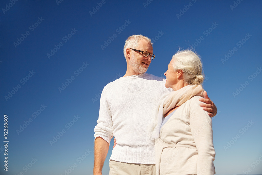 happy senior couple talking outdoors