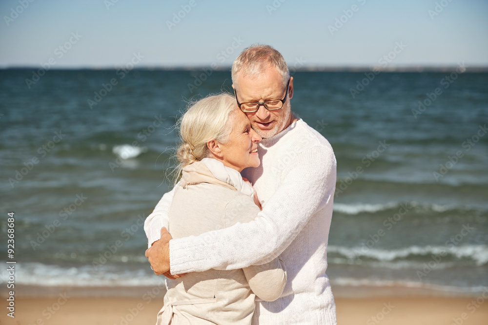 happy senior couple hugging on summer beach happy senior couple hugging on summer beach