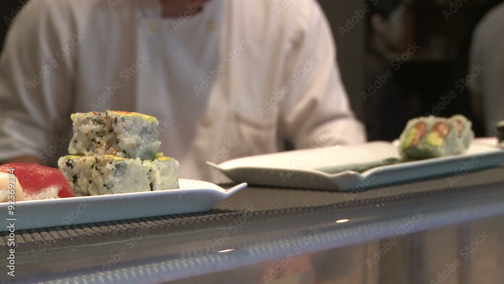 Sushi orders being put out for pick up. Sushi orders being put out for pick up.