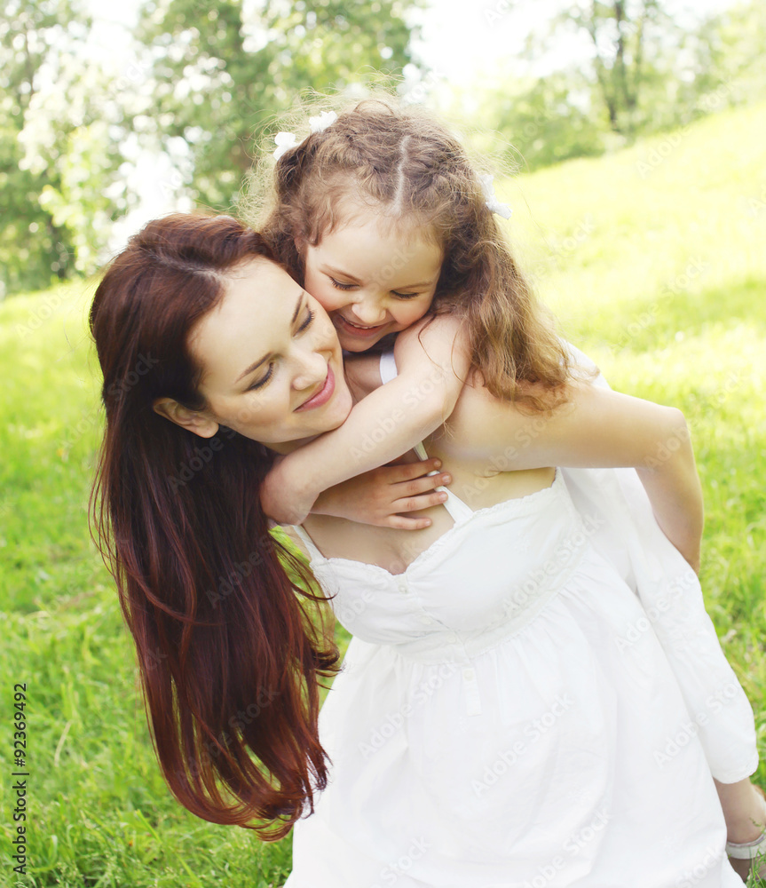 Happy mother and child having fun together in summer park Happy mother and child having fun together in summer park