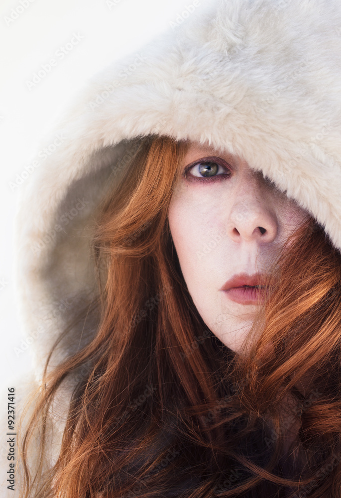 Red head woman with white hood. Red head woman with white hood.