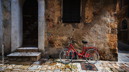 Abandoned bike on the Italian street in the old Tuscany