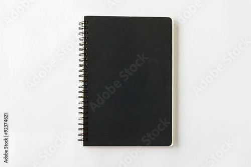 spiral black notebook on white background