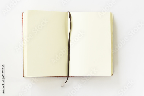 open notebook with mark on white background