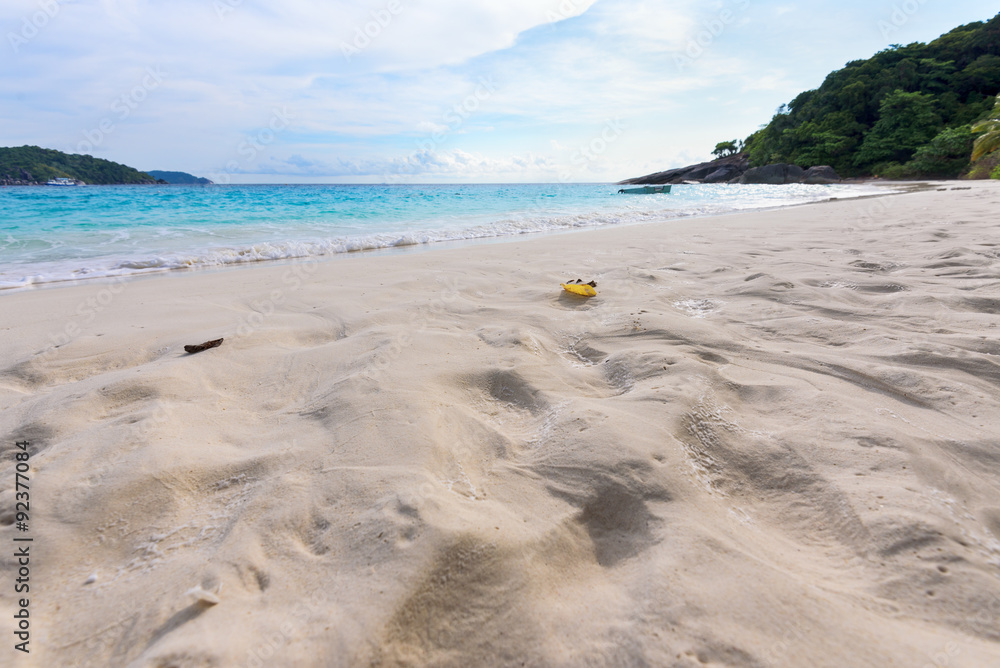 Visitors footprints on sand at beach near the sea during morning high tide remove traces of the chaos return to peaceful in Koh Miang island, Mu Ko Similan National Park, Phang Nga, Thailand