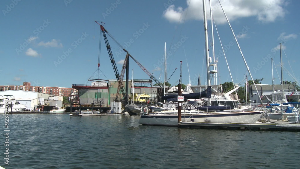 Crane at marina and moored boats. Crane at marina and moored boats.