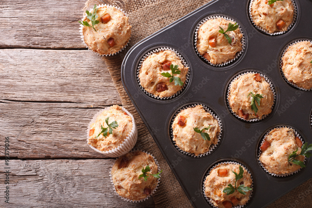 muffins with ham and cheese in baking dish. Horizontal top view
muffins with ham and cheese in baking dish. Horizontal top view