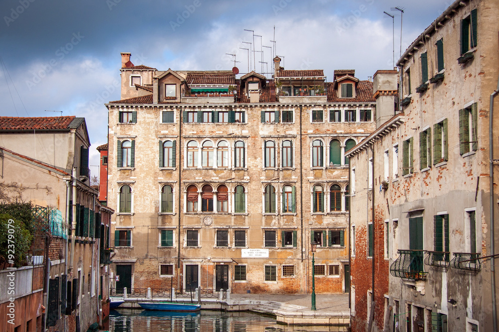 City landscape of Venice. The street canal with old houses, boats