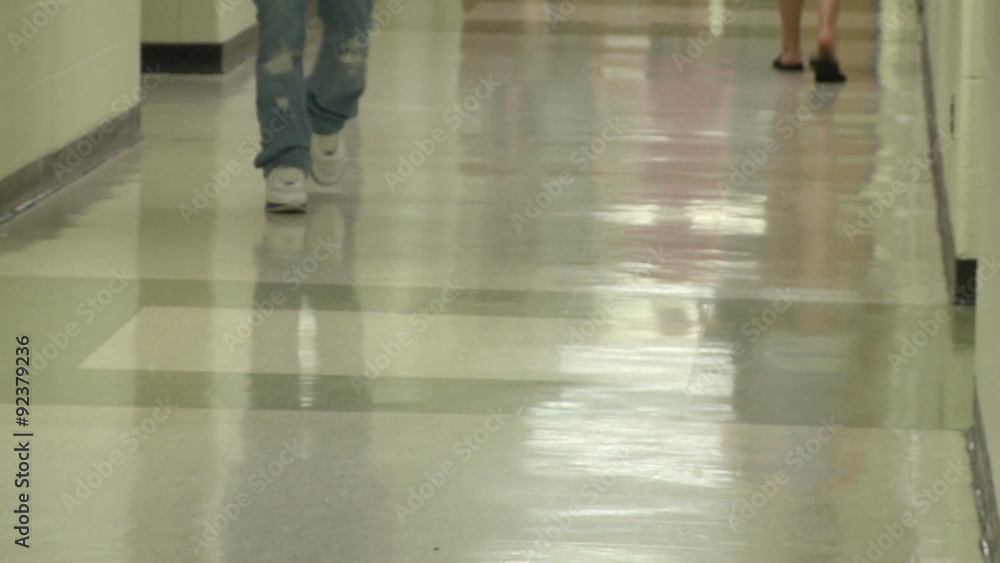 Junior high students walking down hallway Junior high students walking down hallway