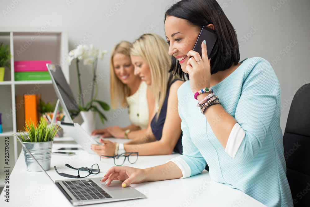 Creative women colleagues working in the office Creative women colleagues working in the office